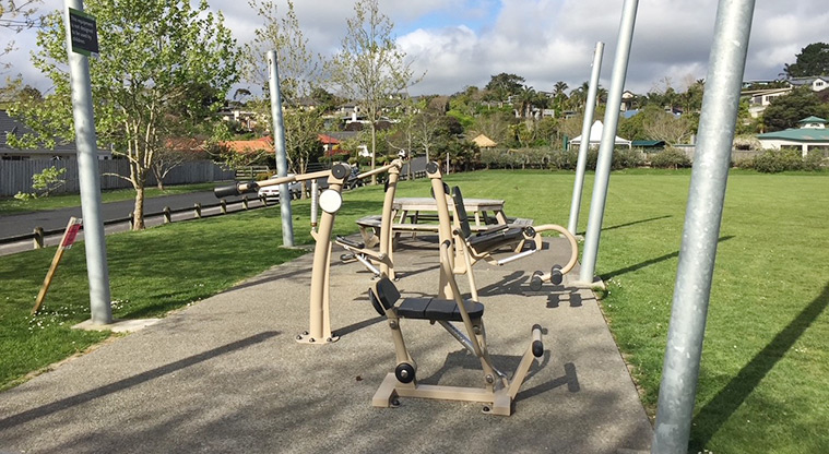 Glasgow Park - Pieces of fitness equipment with a picnic table and open space in the background. Photo credit: T Hodder.