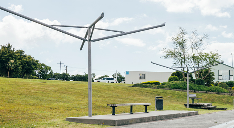 Goodall Reserve - Seating along the edge of the skate park with a grassed hill and houses in the background. Photo credit: J Farnworth.