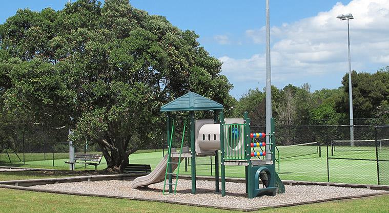 Greenhithe War Memorial Park - Small playground with the tennis courts in the background.