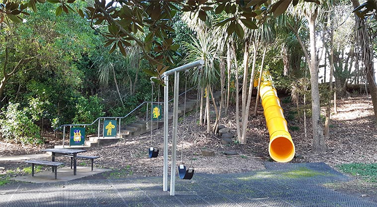 Gribblehirst Park – Swing set, seating area and slide. Steps leading to upper playground.