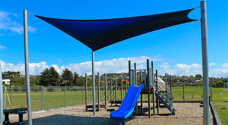 Gulf Harbour Recreation Reserve – Children's playground with slide, climbing equipment, and a shade sail. Photo credit: M Loubser.