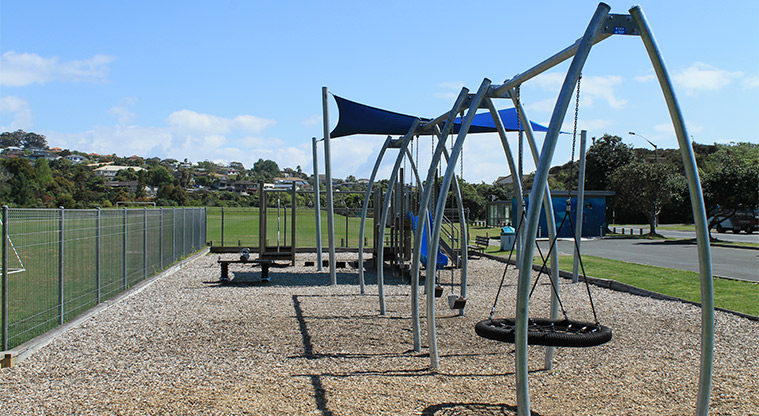 Gulf Harbour Recreation Reserve - Children's playground with slide, climbing equipment, shade sail and swings. Photo credit: M Loubser