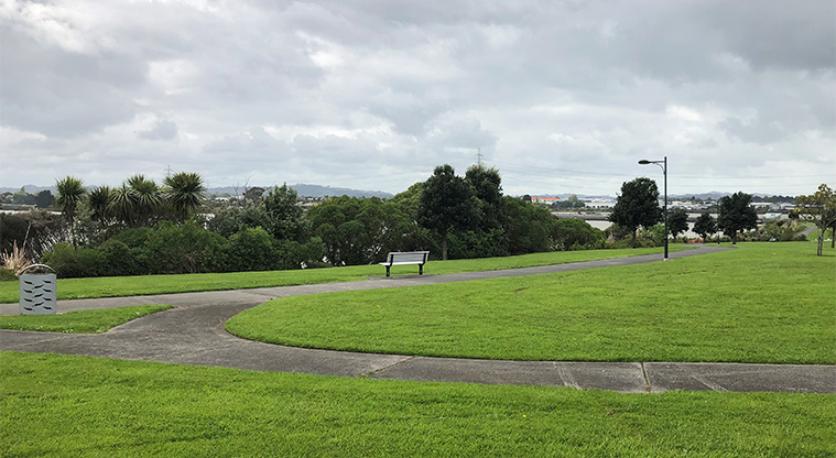 Harbourside Esplanade Reserve - Part of the network of paths around this reserve with seating and trees in the background.