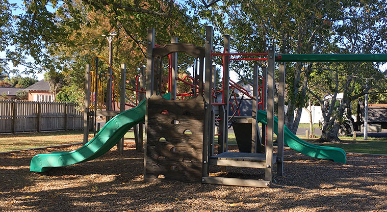 Harbutt Reserve - Playground made up of a wooden structure with steps, ladders, walking bridges and two slides, swings and spinner. Photo credit: J Grigg.