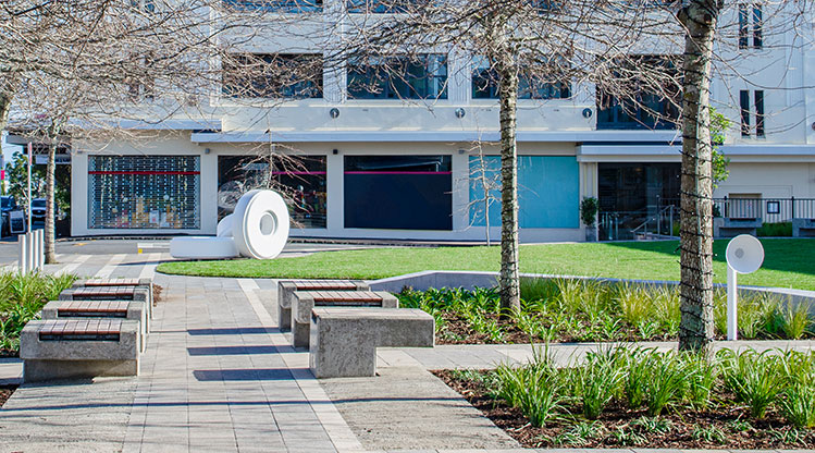 Heard Park - Seating and areas of garden with the mint sculpture in the background.