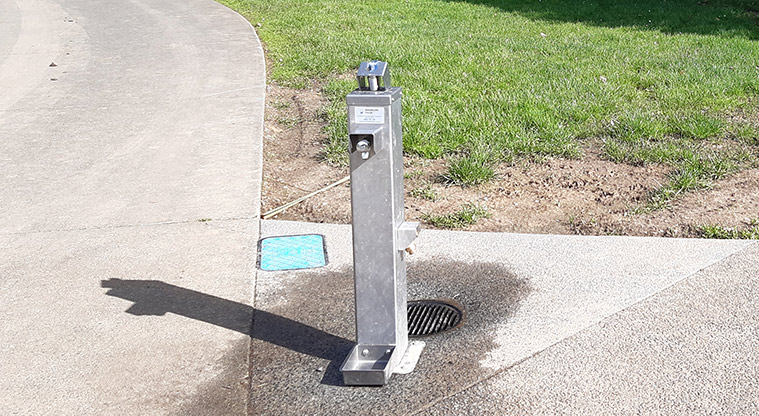 Henderson Park - Drinking fountain on the edge of the path.