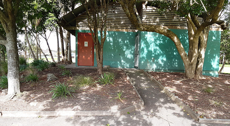 Henderson Park - Close-up of the toilet block sitting under the trees.