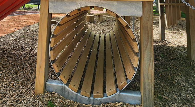 Pā o Tahi / Hillside South Park - Looking through the tunnel under the play module.