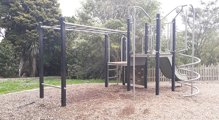 Kell Park - Climbing structure with monkey bars, slide, ladder and twisted poles.