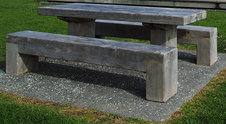 Kelvin Strand - Large wooden picnic table and seating on a concrete base. Photo credit: Tracey Hodder.