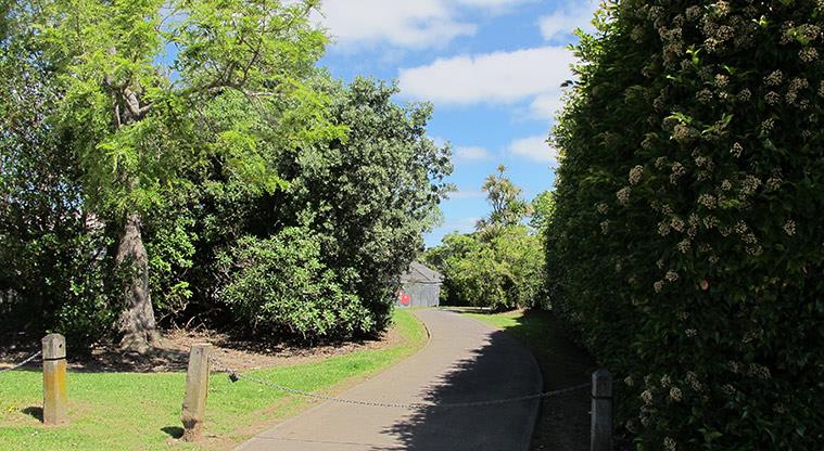 Kepa Bush Reserve - Kepa Road entrance with a path and trees.