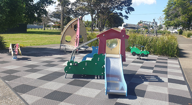 Kuaka Park - Upper playground with play module, slide, bouncy toys, and climbing equipment for smaller children. Photo credit: J Grigg.