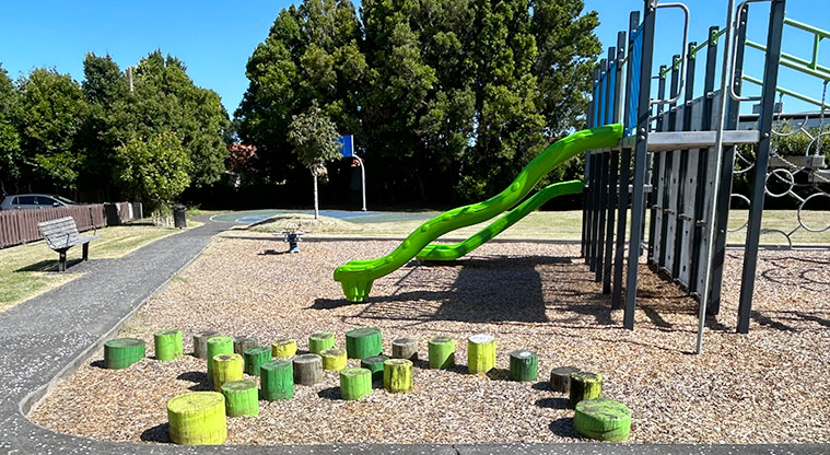 Kupe Reserve - Section of the play module with slides and a platforms, and balancing stumps in the foreground. Photo credit: S Hulse.