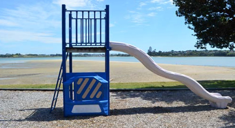 Lansdowne Reserve – Climbing frame with slide, looking towards Oneoneroa / Shoal Bay.