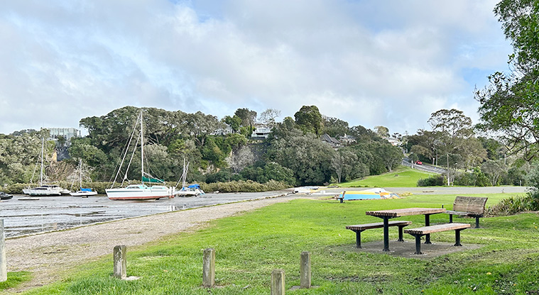 Wai Manawa / Little Shoal Bay Reserve - Picnic table and seating, with boats moored in the bay. Photo credit: S Hulse.