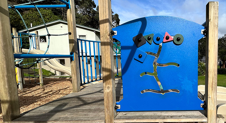 Wai Manawa / Little Shoal Bay Reserve - Interactive play board attached to the side of a section of the playground. Photo credit: S Hulse.