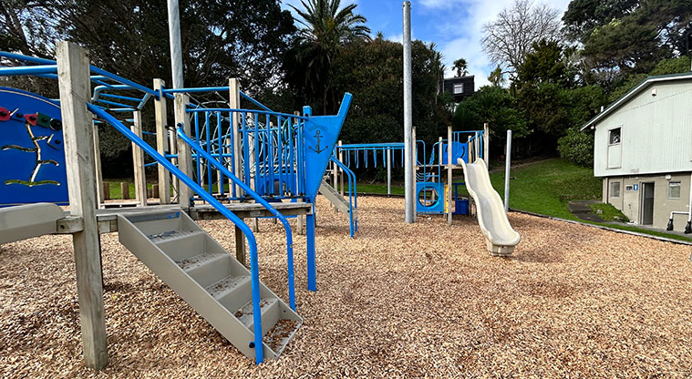 Wai Manawa / Little Shoal Bay Reserve - Section of the playground with steps up to a ramp, climbing equipment and a slide. Photo credit: S Hulse.