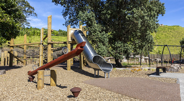 Te Pane o Mataoho / Te Ara Pueru / Māngere Mountain - Section of the māra hupara (play area) with a seesaw, slide, climbing equipment and more.