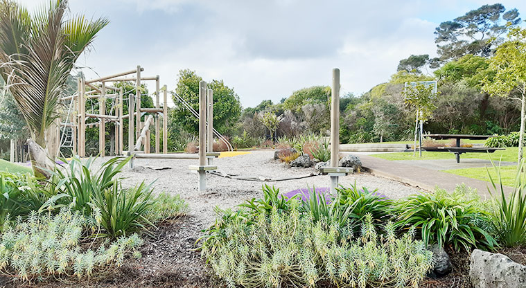 Manuka Reserve - Section of the playground with a garden in the foreground. Photo credit: S Hulse.
