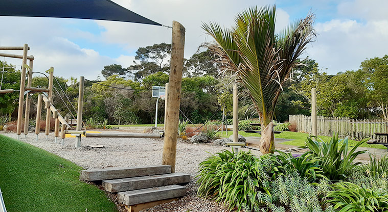 Manuka Reserve - Section of the playground with a garden in the foreground. Photo credit: S Hulse.
