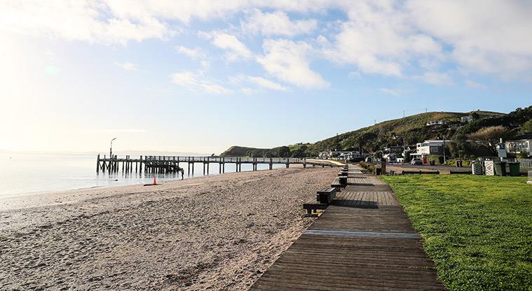 Maraetai Beach - Looking east from the beach to the jetty.