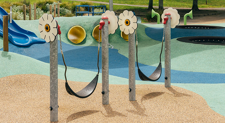 Marlborough Park - Low sling swings with interactive flowers on the poles. Photo credit: J Farnworth.