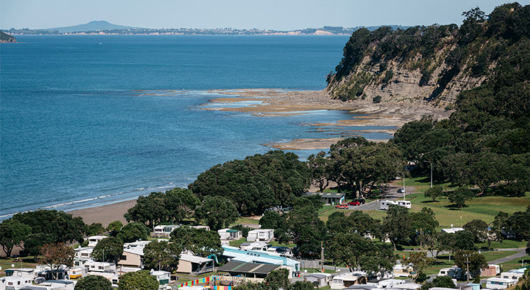 Martins Bay Holiday Park - View looking over the holiday park with the bay in the background.