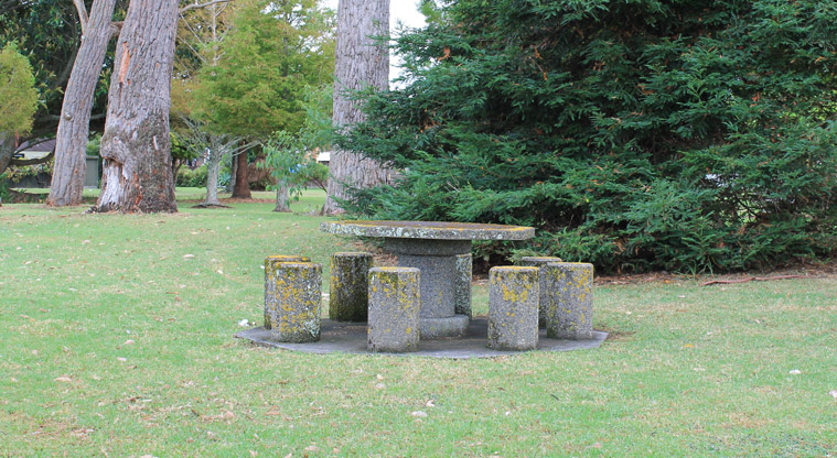 Maygrove Park – A round stone picnic table and chairs. Photo credit: M Loubser.