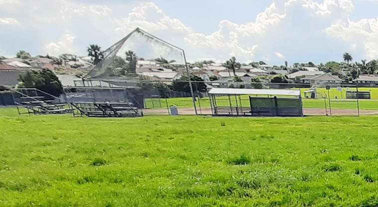 Meadowlland Park - Softball diamond with fencing around it, and seating.