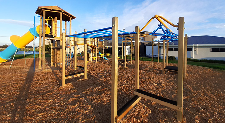 Meadowland Park -Balance beams, swinging equipment, play tower and slide.