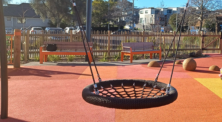 Michaels Avenue Reserve - Basket swing with seats in the background.