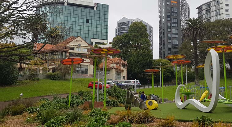 Myers Park - Playground, Myers Park Kindergarten heritage building (now an early learning daycare centre) and Queen street in the background.