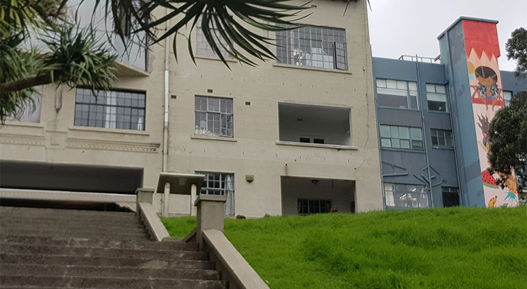 Myers Park - One of several buildings with mural paintings surrounding the park.