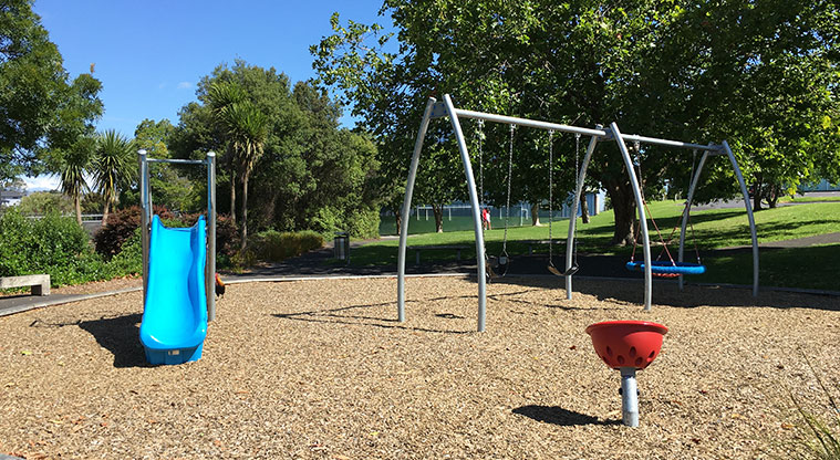 Olympic Park - Small playground with slide and swing set at the Portage Road side of the park.