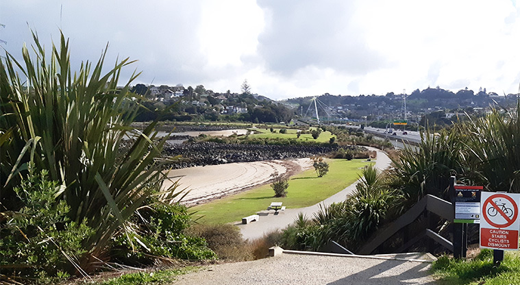 Onehunga Bay Reserve - Steps down from the upper path to the main reserve area and caution sign.