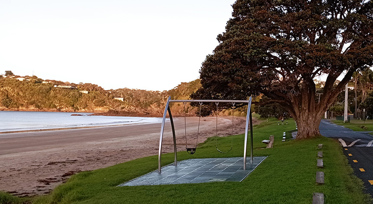 Oneroa Beach Reserve - Swing set with the beach on the left and the road on the right. Photo credit: K Sumner.
