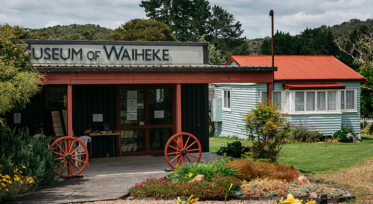 Onetangi Sports Park - Waiheke Museum and historical village buildings with gardens and trees.