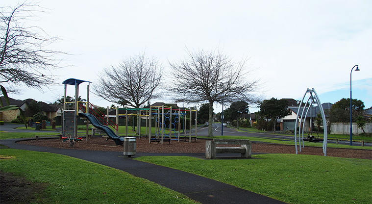 Paremuka Lakeside - Playground with swings, paths, seating and a rubbish bin. Photo credit: Tracey Hodder.
