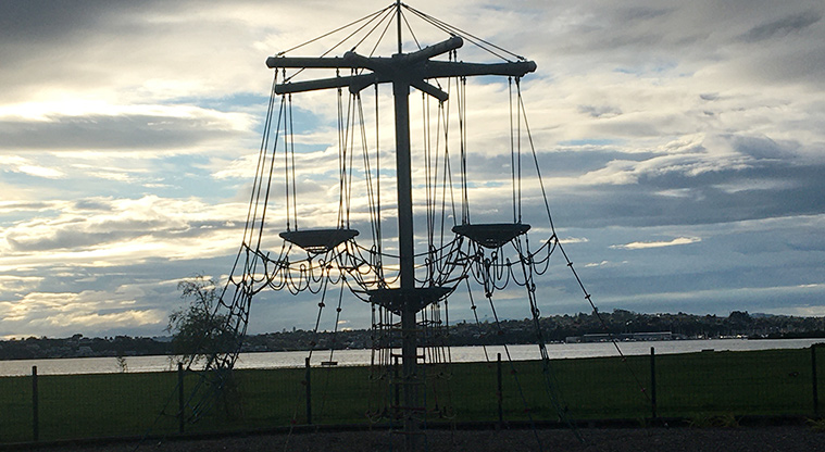 Roberta Reserve - Climbing nets with a view of the Tāmaki Estuary at dusk.