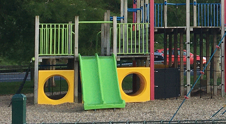 Roberta Reserve - A section of the playground with bright green slides for the younger children.
