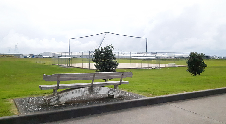 Rongomai Park - Seat on the edge of the car park, and the softball/baseball diamond in the background.