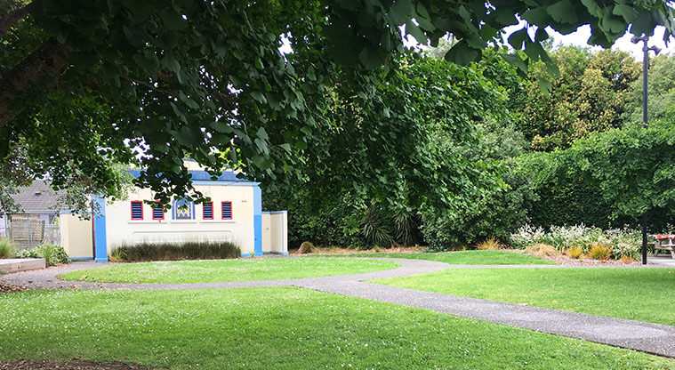 Sandringham Reserve - Grassed area with paths, trees and a building in the background. Photo credit: S Hulse.