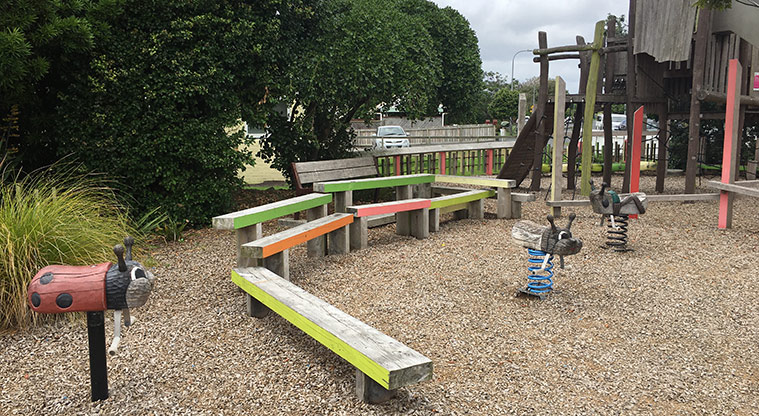 Sandringham Reserve - Three bouncy toys and colourful balance beams with trees and part of the fence in the backgroun. Photo credit: S Hulse.