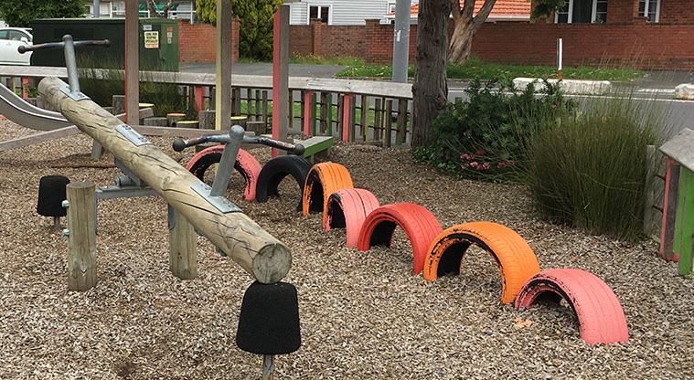 Sandringham Reserve -  Wooden seesaw and colourful half tyres for balancing. Photo credit: S Hulse.