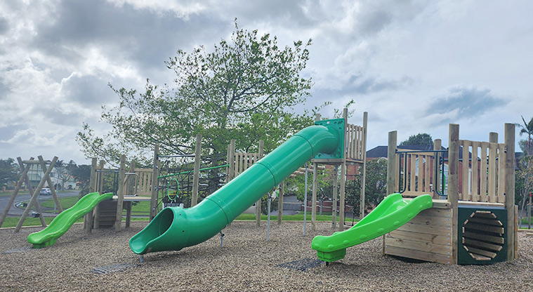 Santa Cruz Park - The slides leading from the platforms of the play modules, with the swings in the background.
