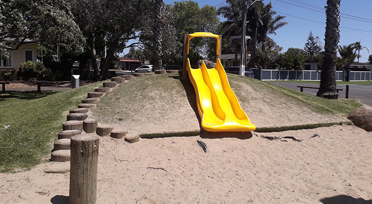 Seaside Park - Stepping poles up the mound to the double yellow slide running down the slope.