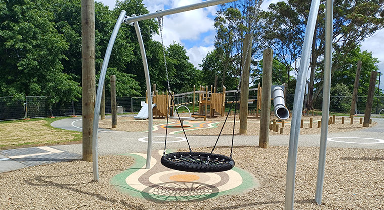 Shepherds Park – Basket swing with the rest of the playground in the background.