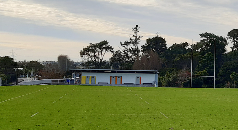 Tiakina / Sister Rene Shadbolt Park - Accessible toilets with a section of one of the sports fields in the foreground.