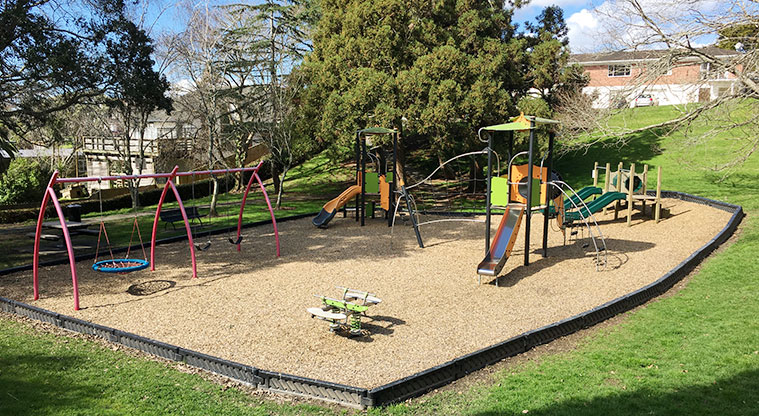Taumata Reserve - Looking down the hill at the whole playground and trees in the background. Photo credit: S Hulse.