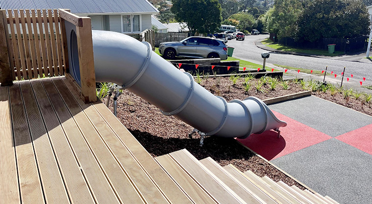 Taurus Crescent Reserve - Tube slide running down the slope from a wooden platform and part of the steps.